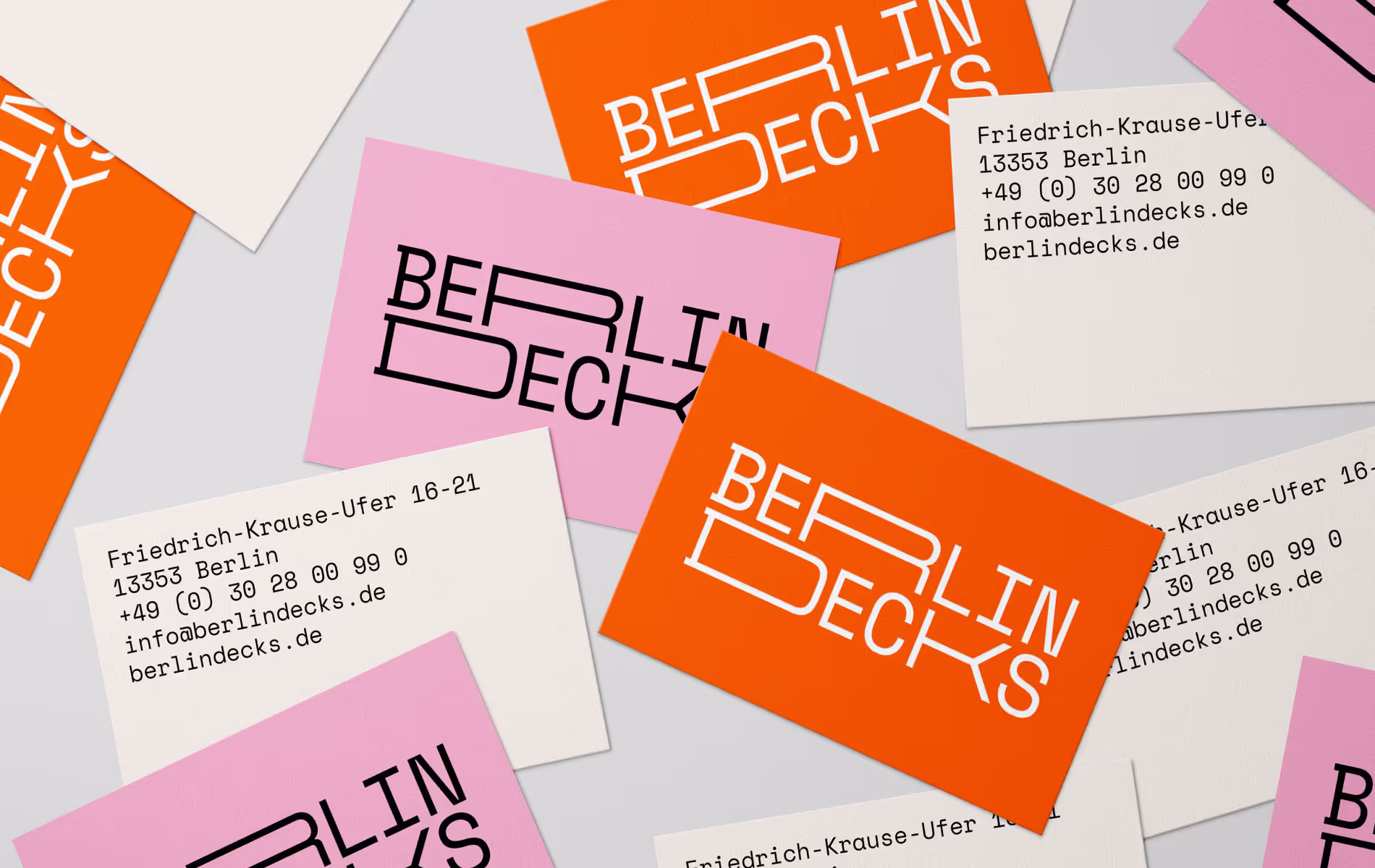 A spread of business cards for "Berlin Decks",showing contact information, as part of the corporate design