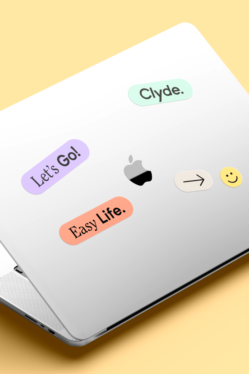 The Laptop with Stickers from Clyde Brand Identity Design, with texts: Easy life, Let's go.