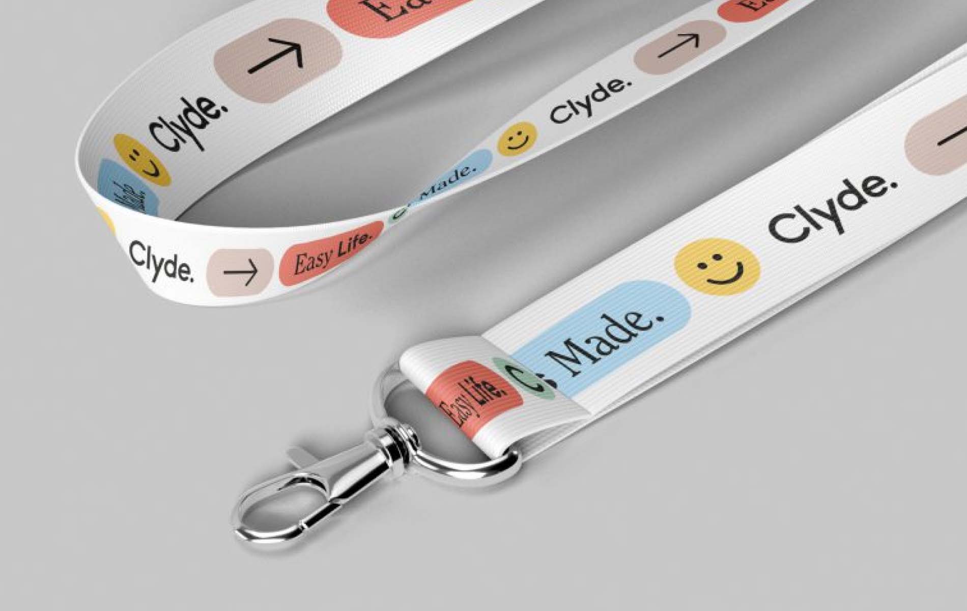 A Lanyard of Clyde, yellow, sky blue and soft red colors, as asset of the corporate design