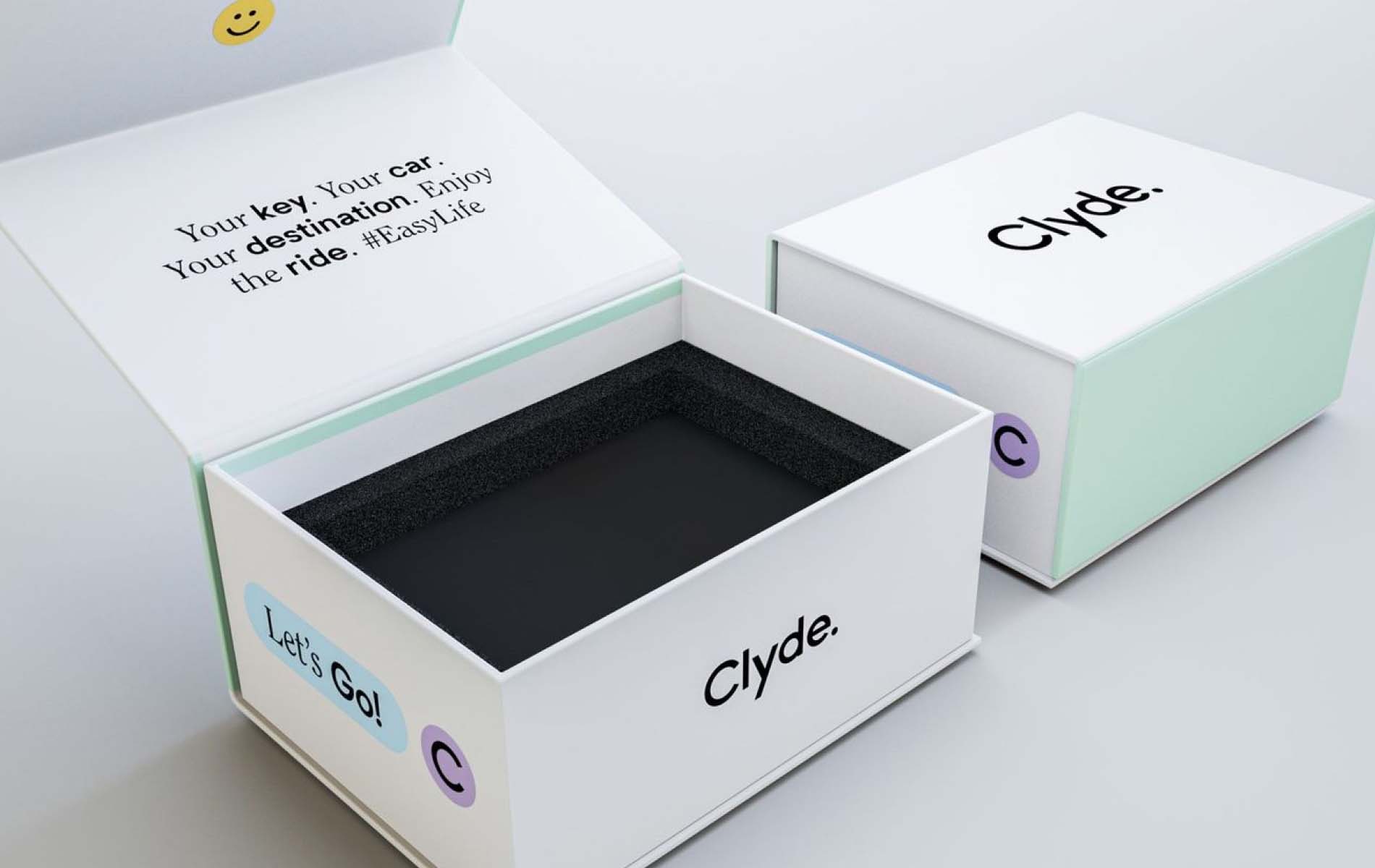 White box of Clyde, with text "Your key, your car, Your destination, enjoy the ride", as asset of the corporate design