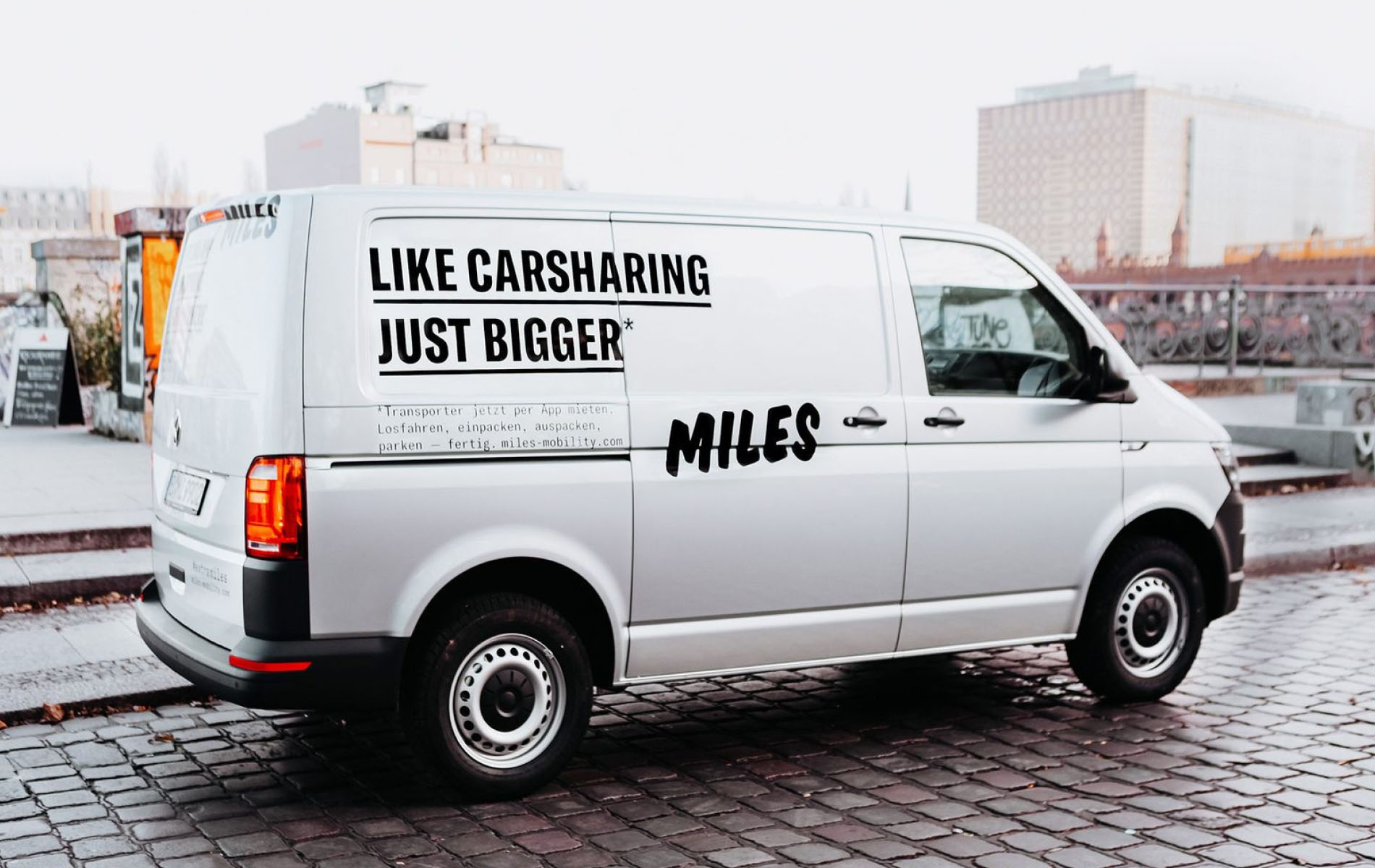 Gray Van is shown from the side, showcasing Miles's brand identity design