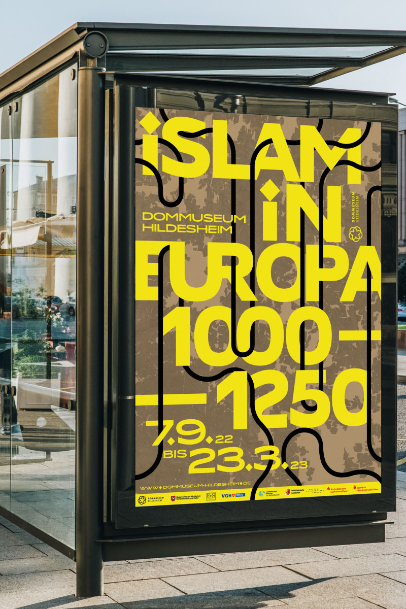 Exhibition poster graphic design at a bus stop reading "Islam in Europa 1000-1250" at Dommuseum Hildesheim, featuring bold yellow text over a brown textured background.