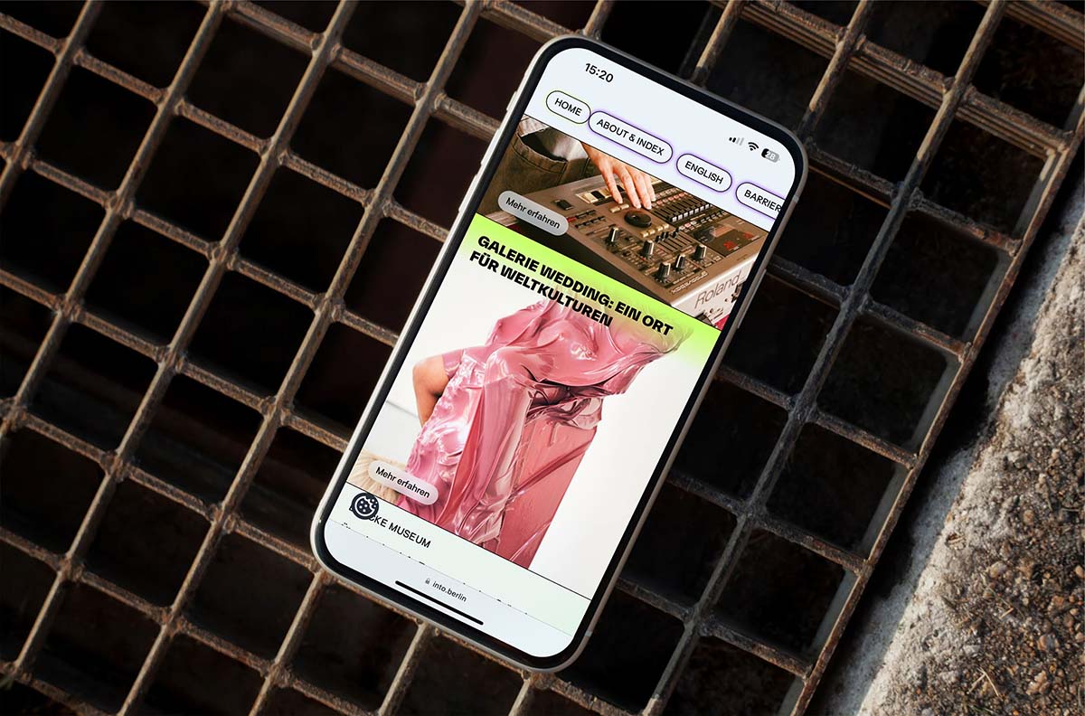 Phone screen showing the website design of Into Berlin