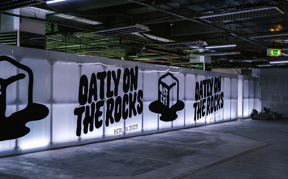 Illuminated “Oatly On The Rocks Berlin 2025” graphics inside an industrial space, produced by a creative agency/marketing agency in Berlin.