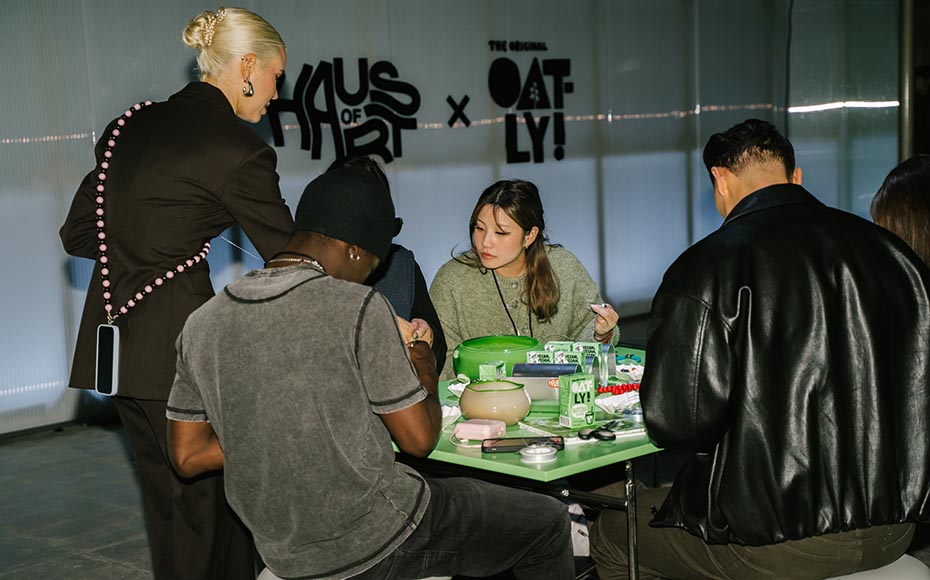 People sitting at a table creating crafts at a Haus of Art × Oatly event, documented by a creative agency/design studio in Berlin.