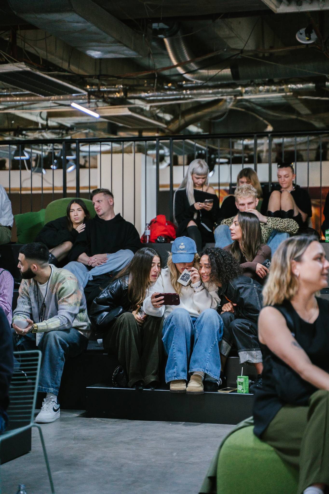 Two guests smiling and holding matcha drinks at Oatly’s new product launch event organized by Cee Cee Creative.