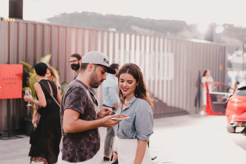 A photograph of people enjoying their food at the KIA launch event.