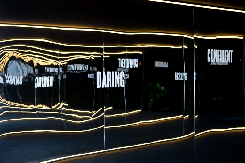 An image of a wall typography design at the KIA launch event, showing the branding and event design.