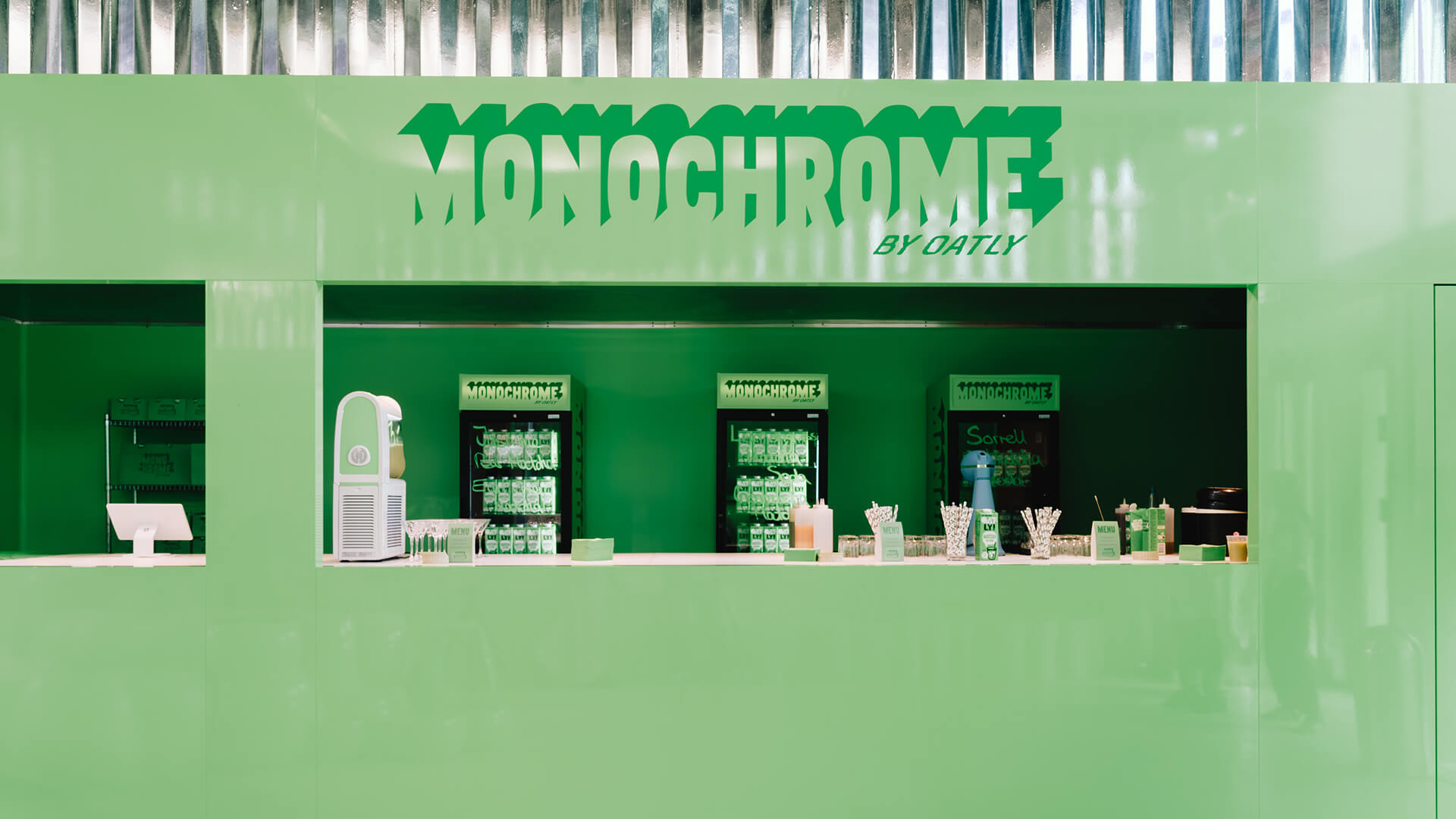 Monochrome by Oatly sales counter with beverage fridges – event design for brand activation