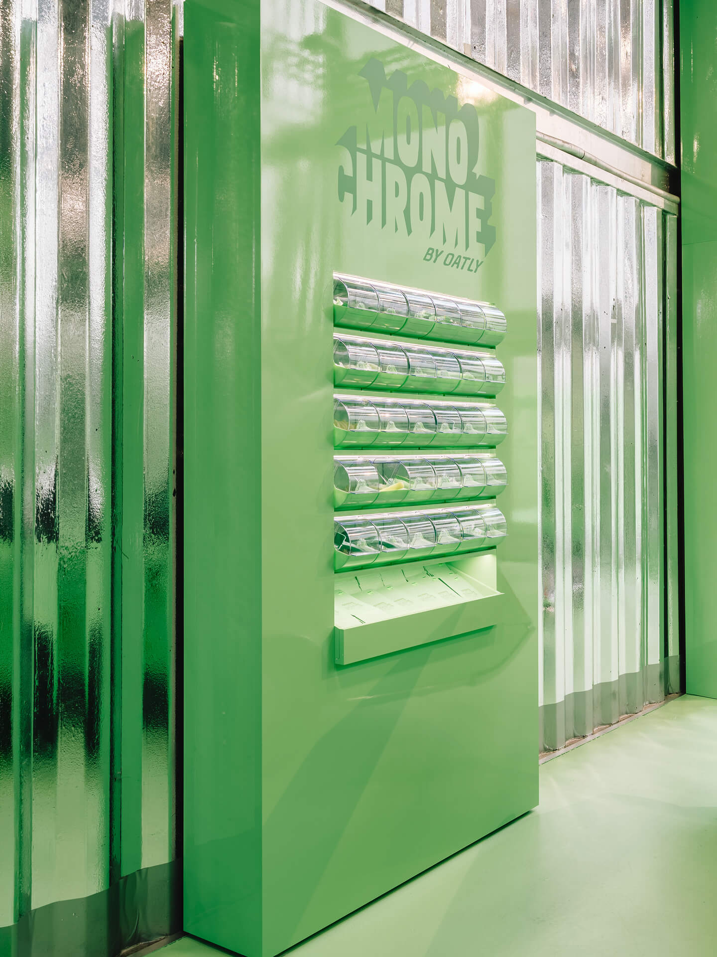 Wall-mounted bin display in Monochrome by Oatly design – retail design detail by the creative agency