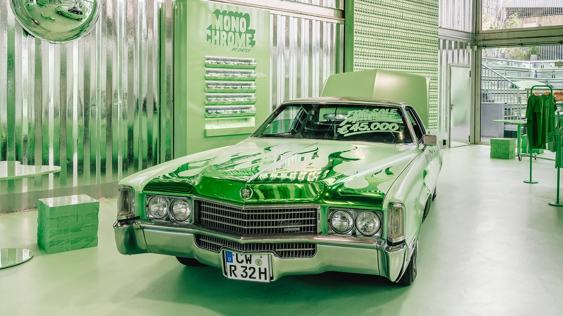 Green vintage Cadillac inside the Oatly Monochrome pop-up store – brand experience and corporate design in action