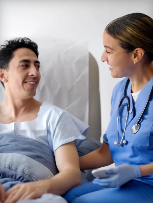 A hospital patient using a mobile device