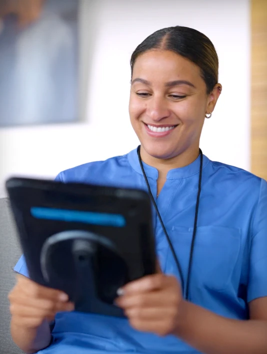 A nurse using a mobile device