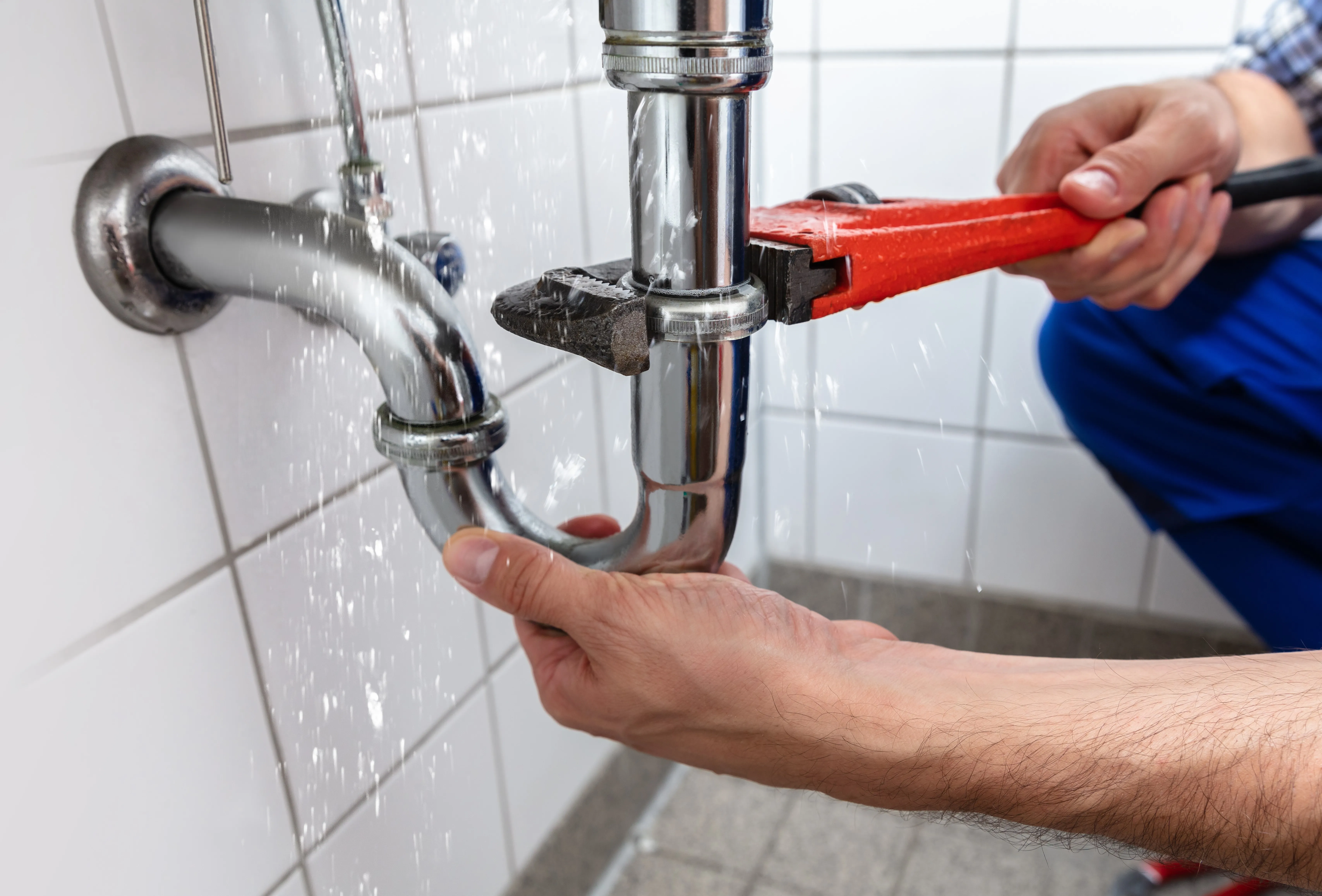 someone installing or fixing a pipe