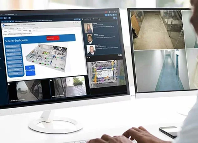 Operator viewing Avigilon access control and video management screens