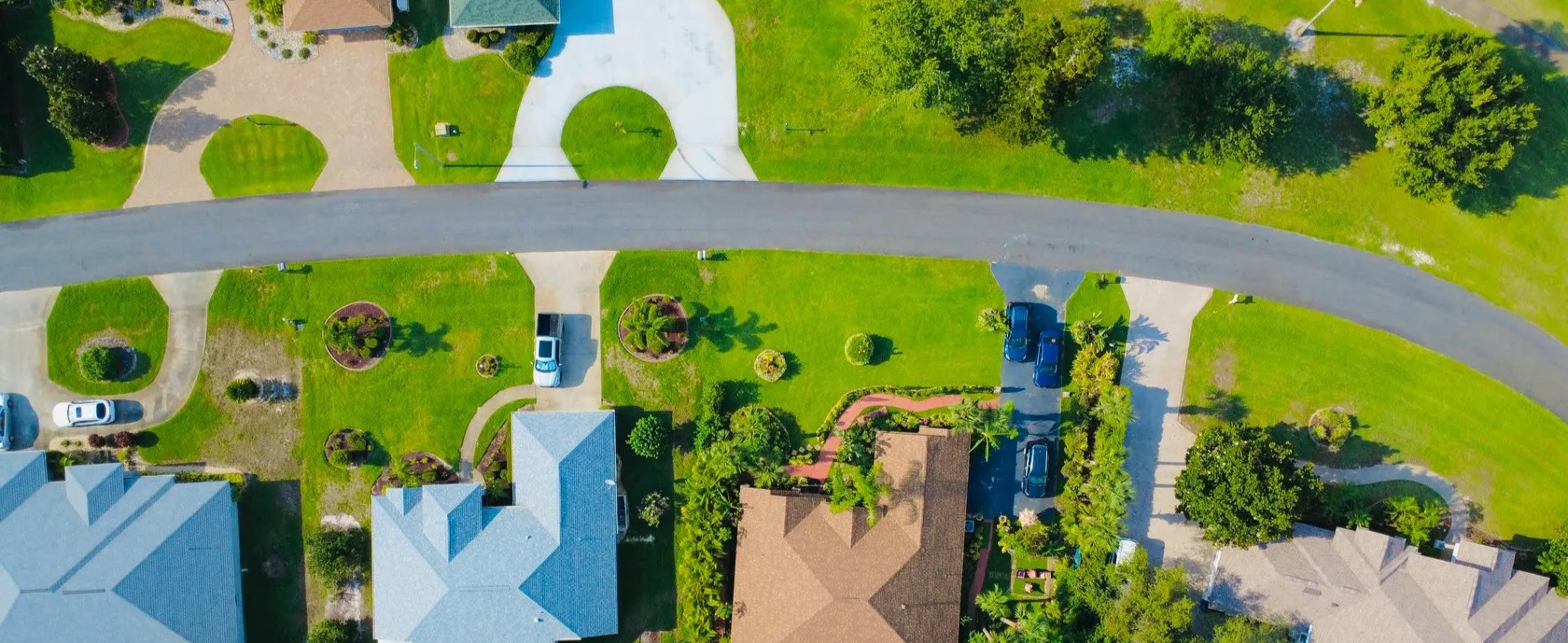 Aerial view of homes on a curved neighborhood street
