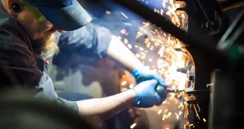 Diesel mechanic performing welding & fabrication services on semi truck in Jackson, GA 