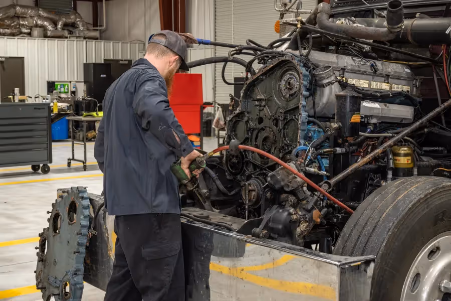 Diesel mechanic performing diesel engine repairs services on semi truck in Jackson, GA