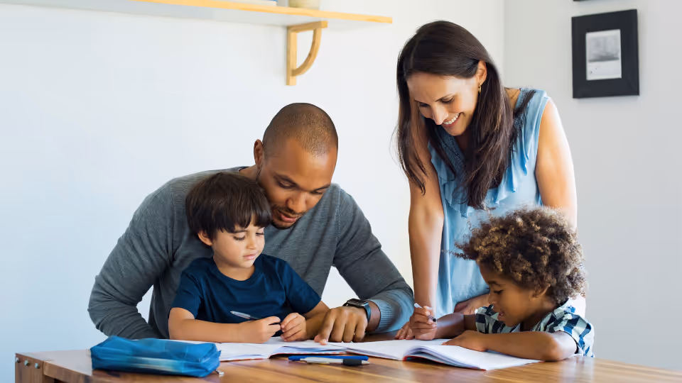 A family works together on homework, emphasizing available resources for parents near Houston, TX