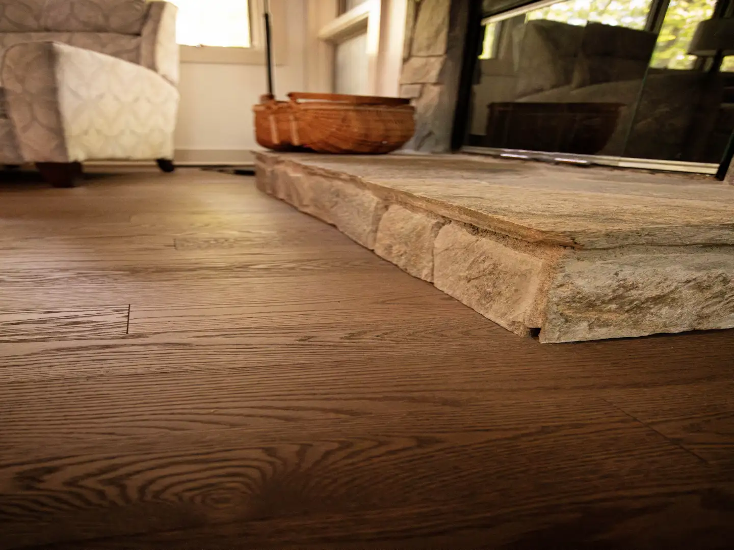 Luxury hardwood flooring install around a fireplace