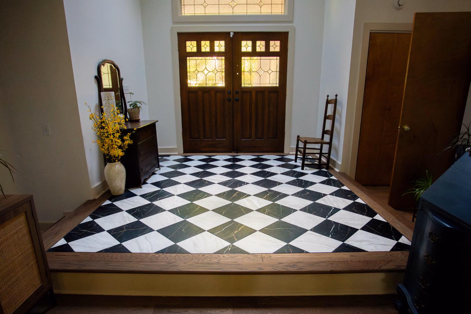 new tile and hardwood flooring installed in an entry way in Anderson, South Carolina.