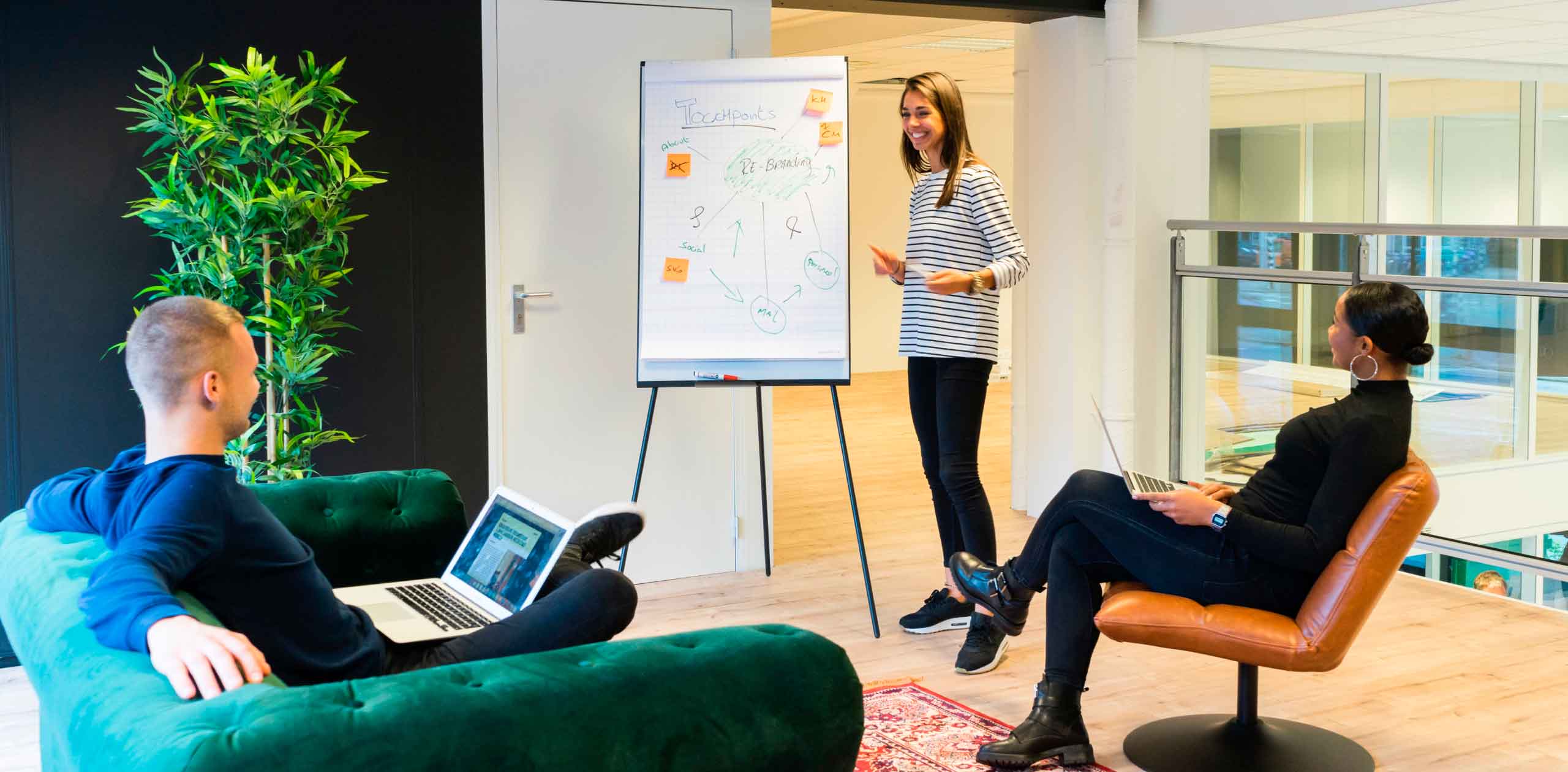 Woman presenting on a whiteboard