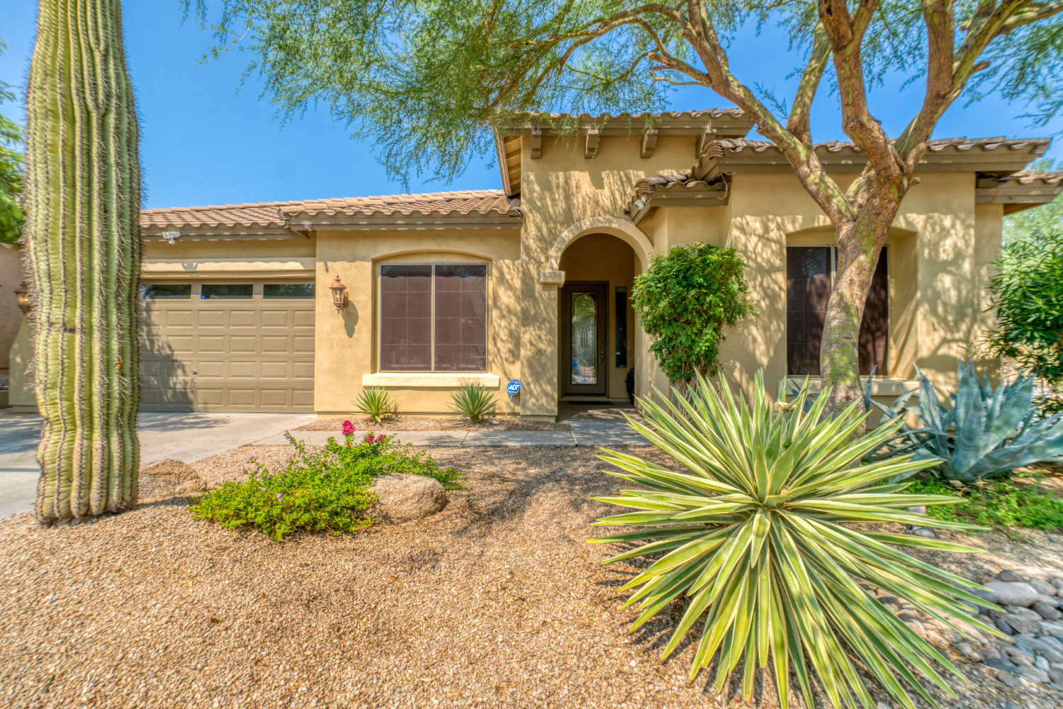 Southwest-style house with desert landscaping.
