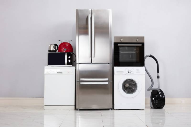 Appliances including fridge, washer, dishwasher, and vacuum cleaner.