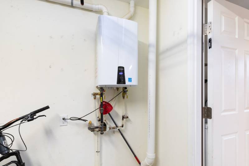 Tankless water heater on wall in Albuquerque home.