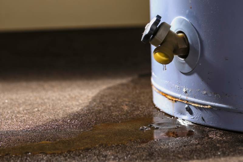 Leaky water heater with rust.