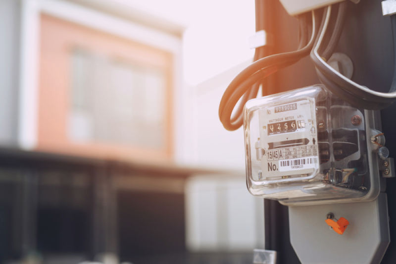 Electric meter on building.