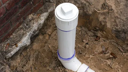 Sewer line repair in dirt.