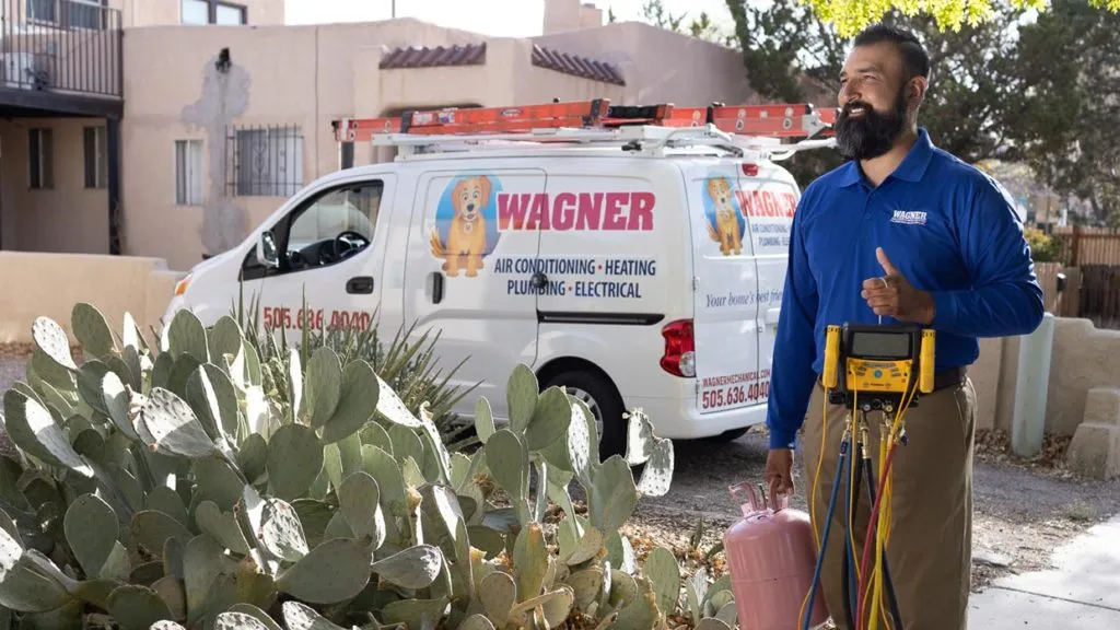 Technician with HVAC tools and Wagner van in Albuquerque.