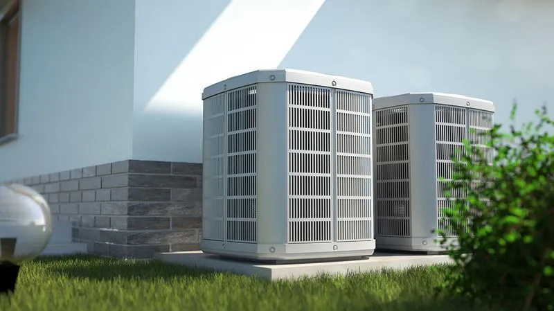 Two outdoor HVAC units next to house