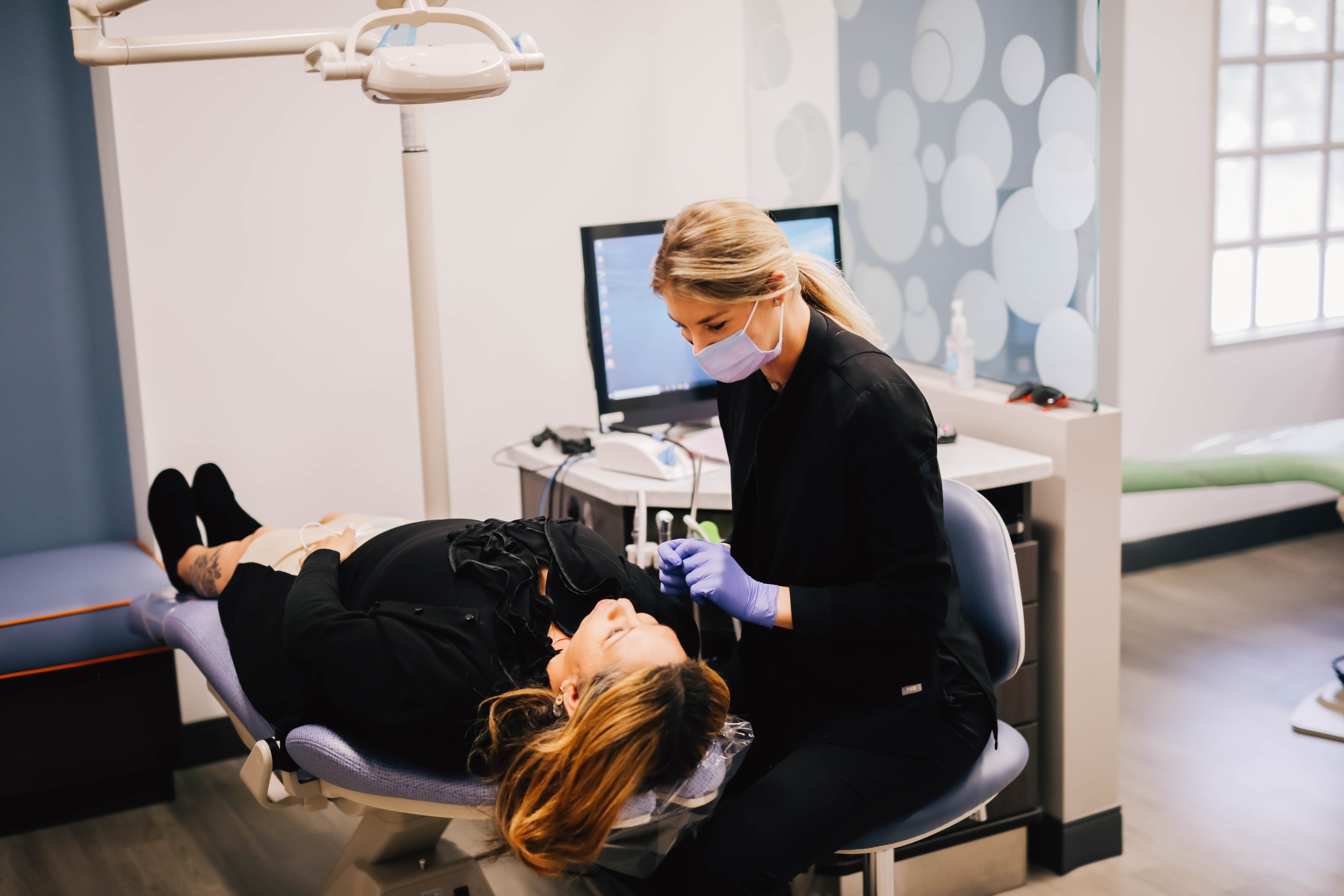 Child's dental exam with x-rays on screen at Encinitas Pediatric Dentistry & Orthodontics in Encinitas, CA