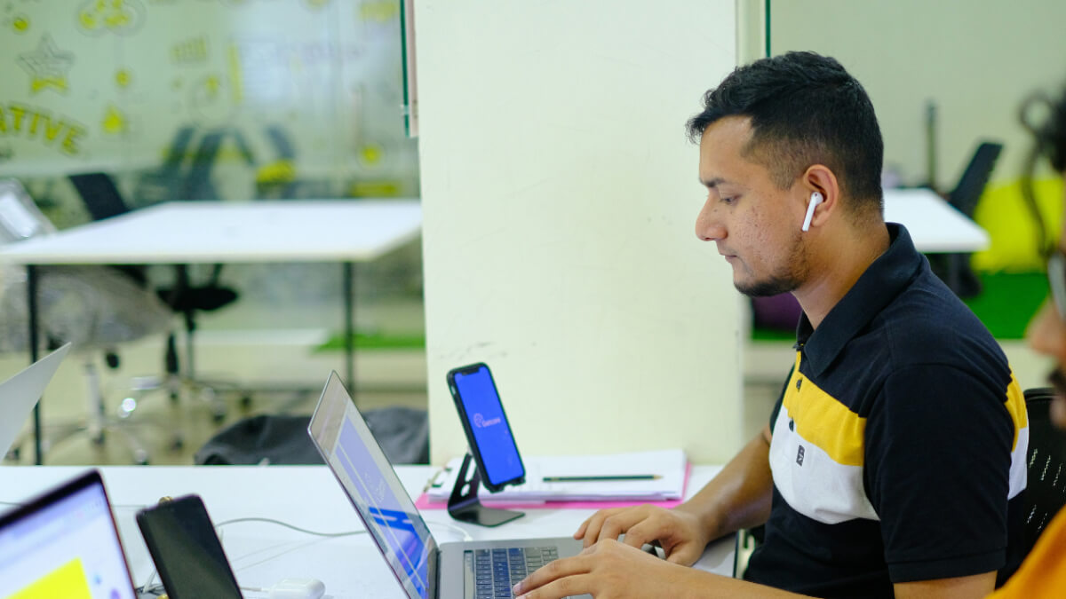 Australian office worker using AI tools on a laptop to streamline daily tasks and improve productivity