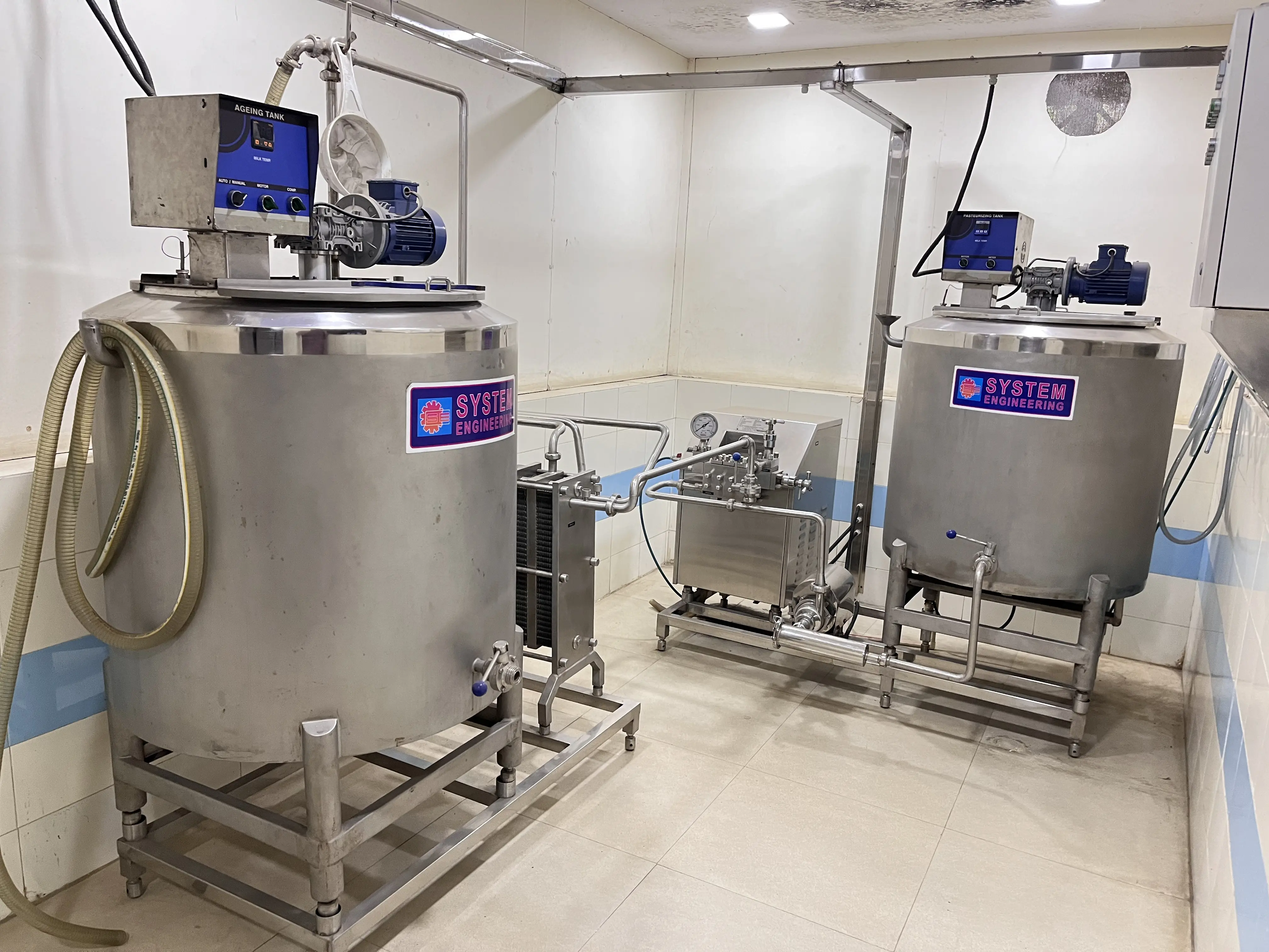 Modern ice cream manufacturing plant interior showing equipment lineup from System Engineering Works
