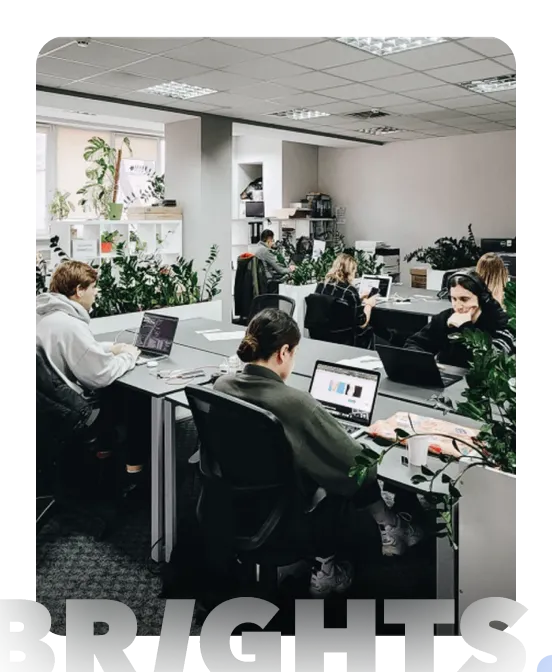 A vibrant office space with employees working at desks 