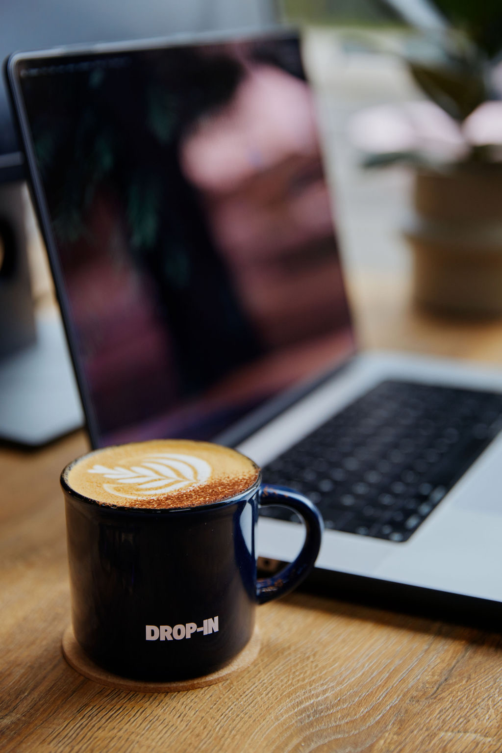 A Drop-in branded latte on a desk at the Clapton caf&eacute;