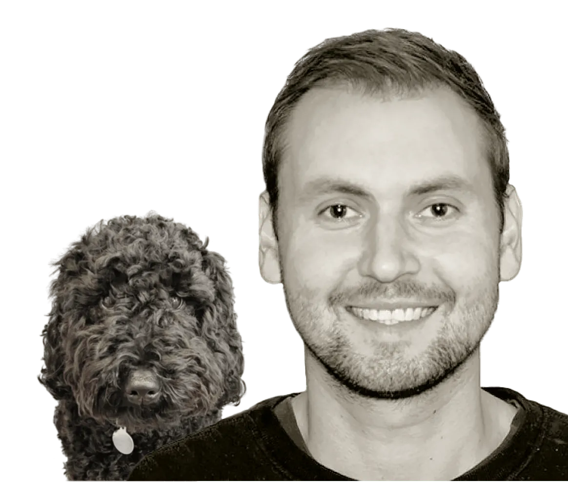 Image of Sean Horwood and a black dog