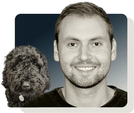 Image of Sean Horwood and a black dog over a blue background
