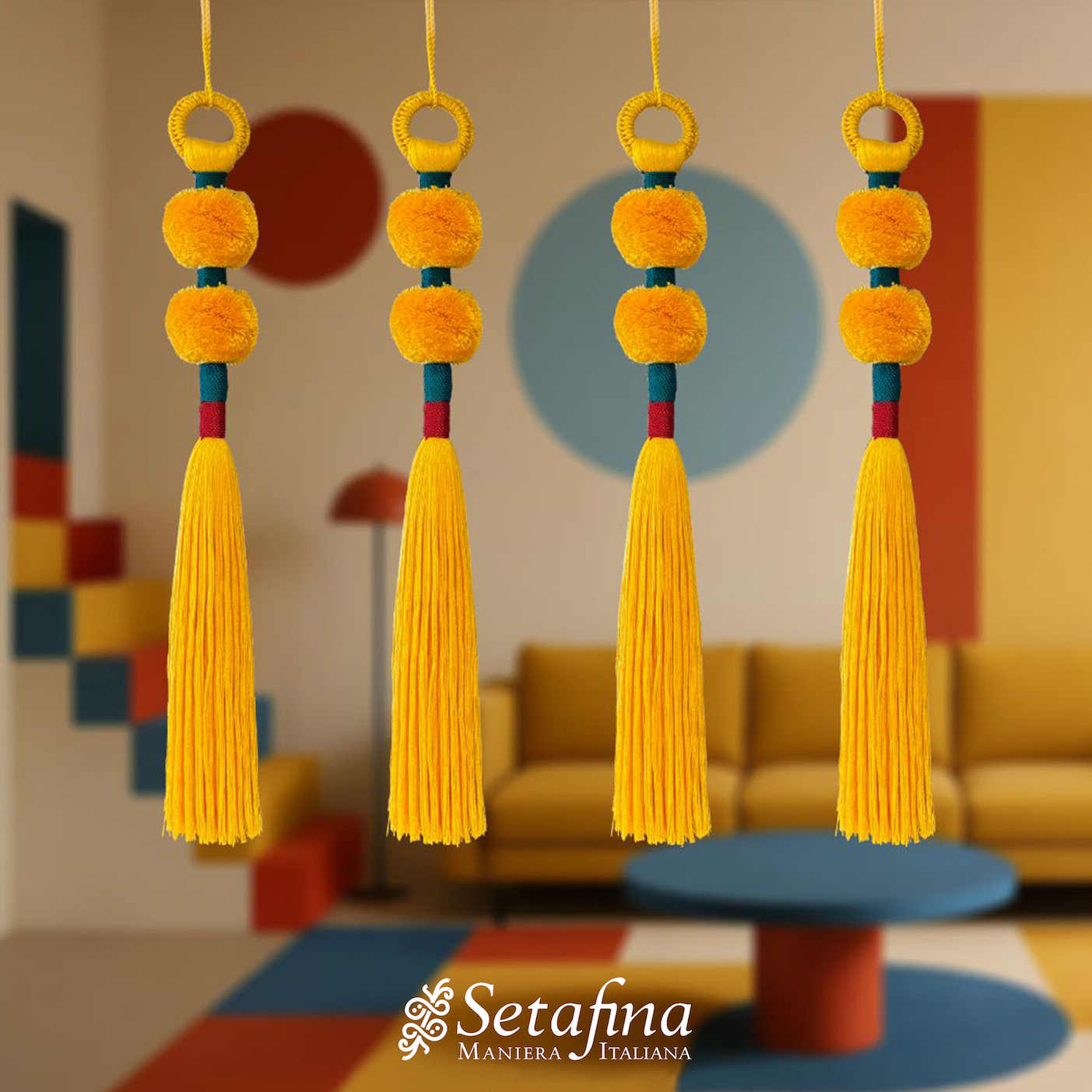 Four orange tassels from our Bau Weave collection hang in a modern, colorful living room. The background features geometric shapes and a cozy yellow sofa, creating a vibrant atmosphere.