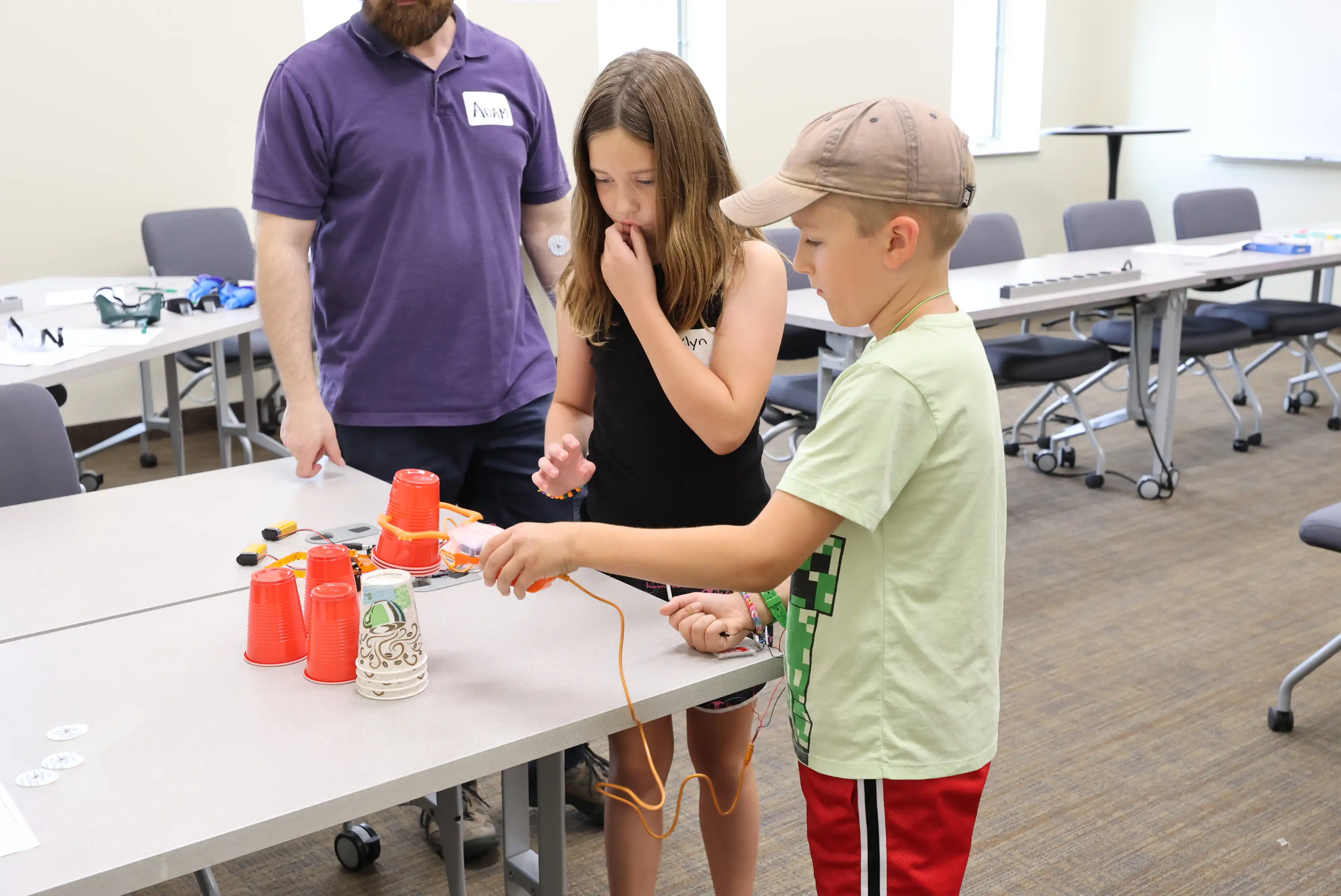 students stacking cups