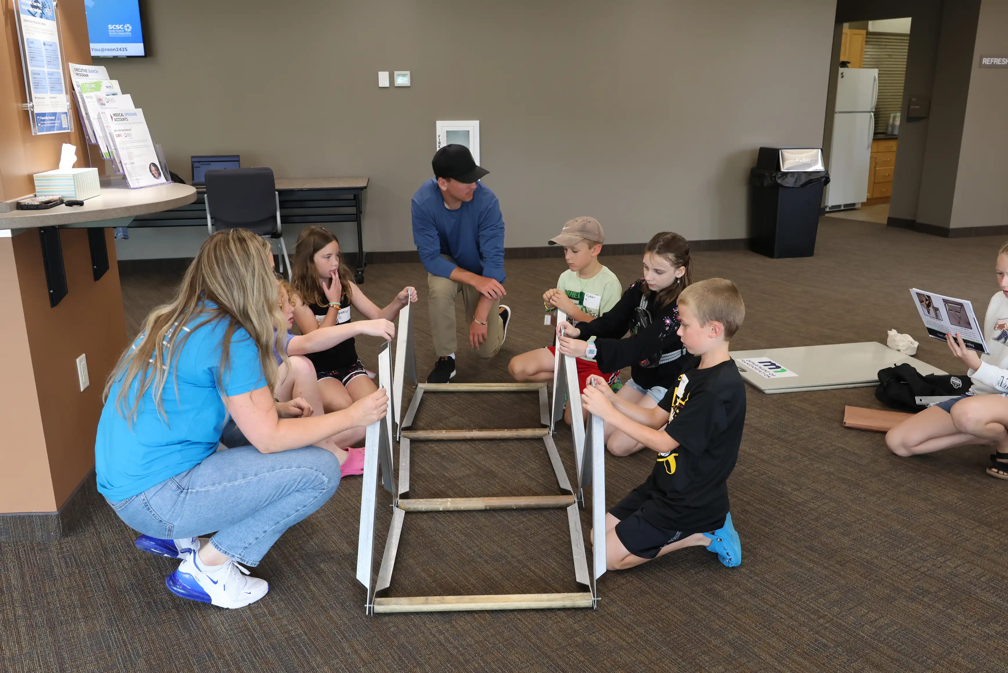 students working to create a bridge