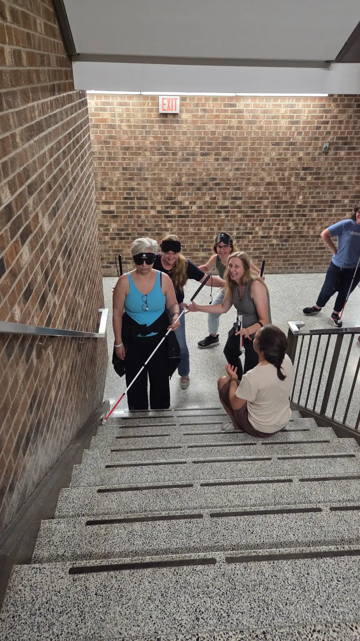 learning how to walk up the steps with a cane and being blind folded
