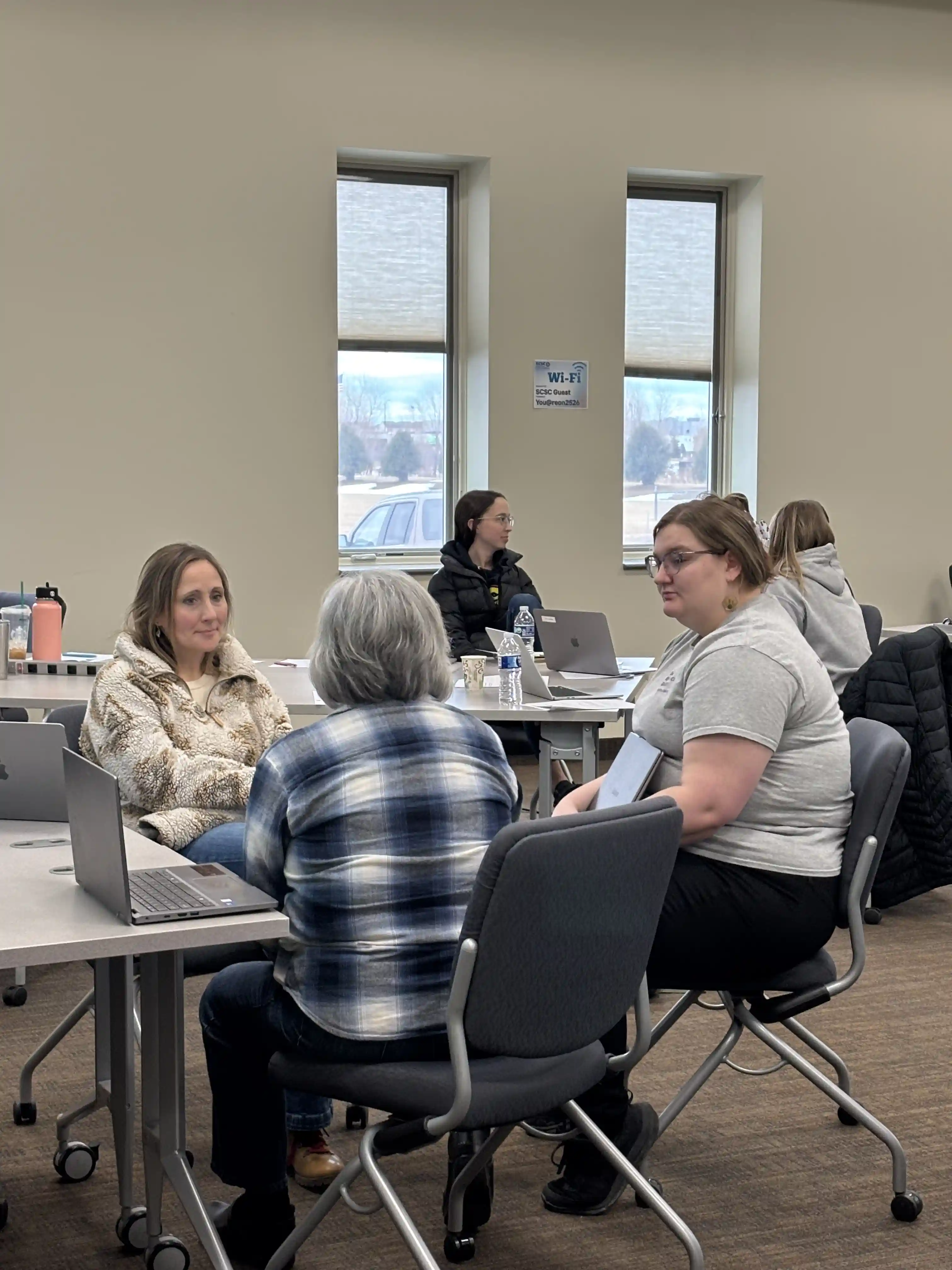 Group of three teachers working together at a table