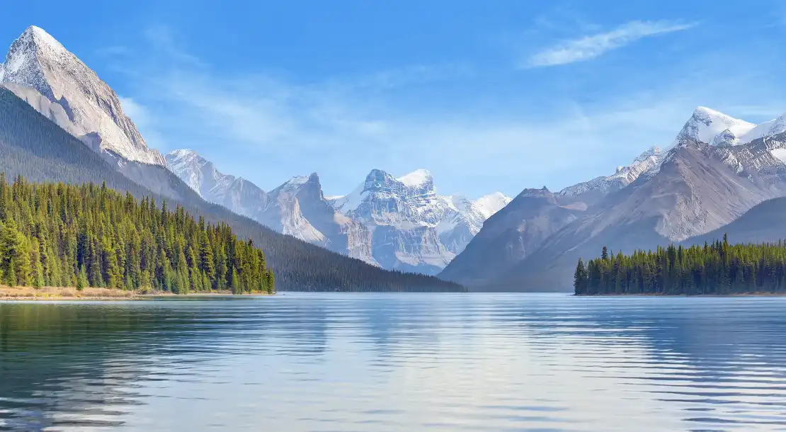 view of mountains in the background with a lake upfront.