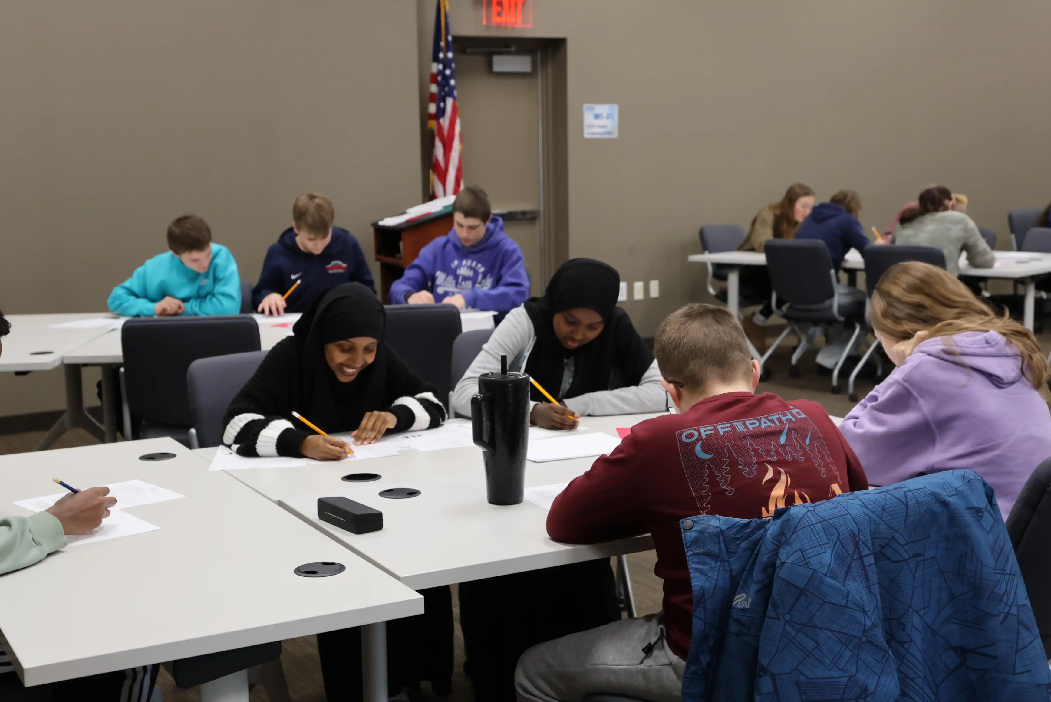 students working on math problems at tables