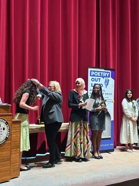 student receiving an award on stage