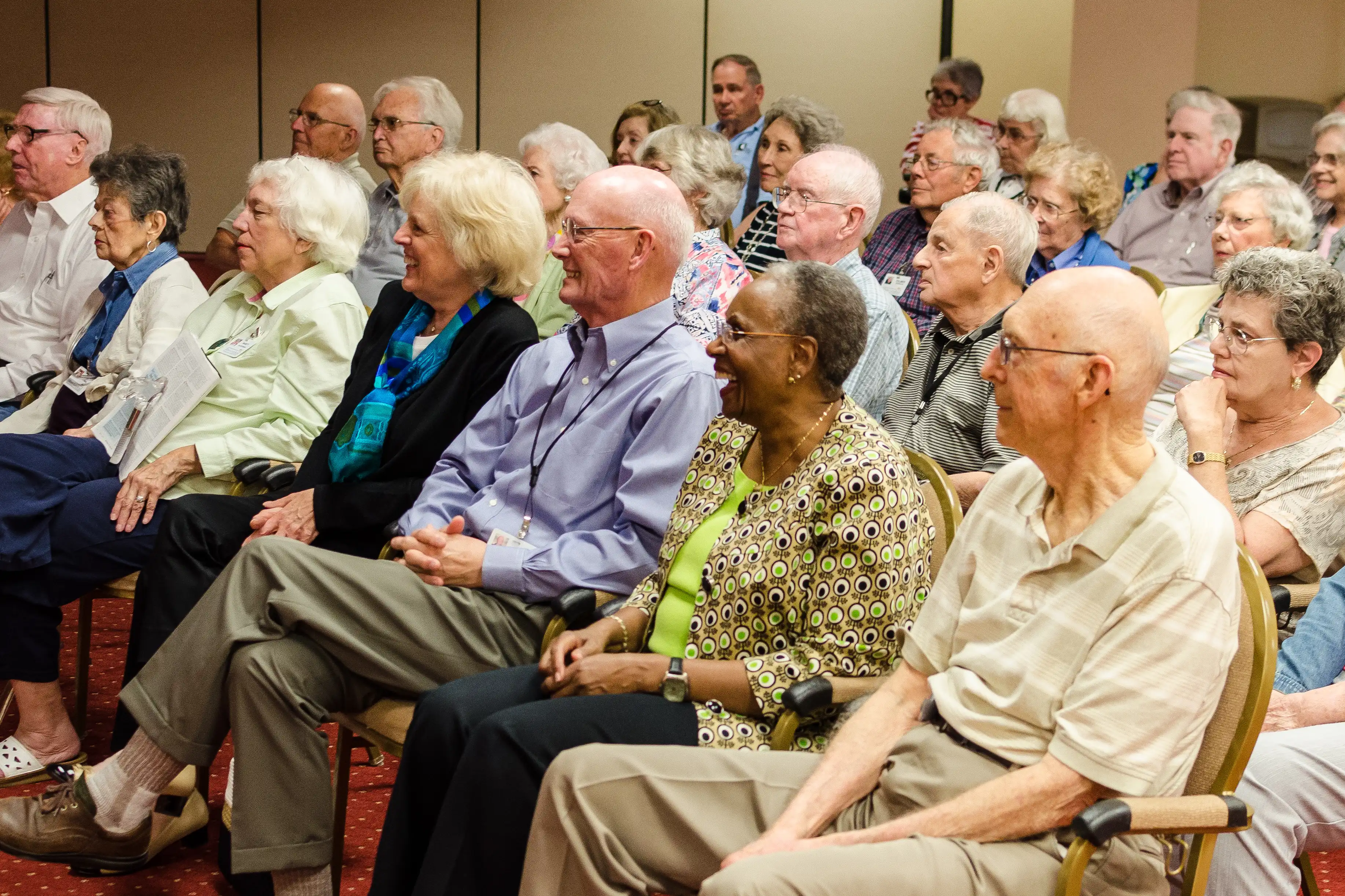 A group of older adults enjoying a virtual field trip.